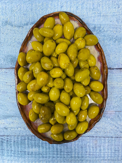 Оливки горные зеленые в масле с лимоном с косточкой 300 гр